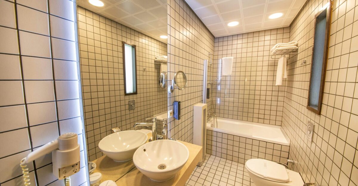 a bathroom with a tub sink and toilet