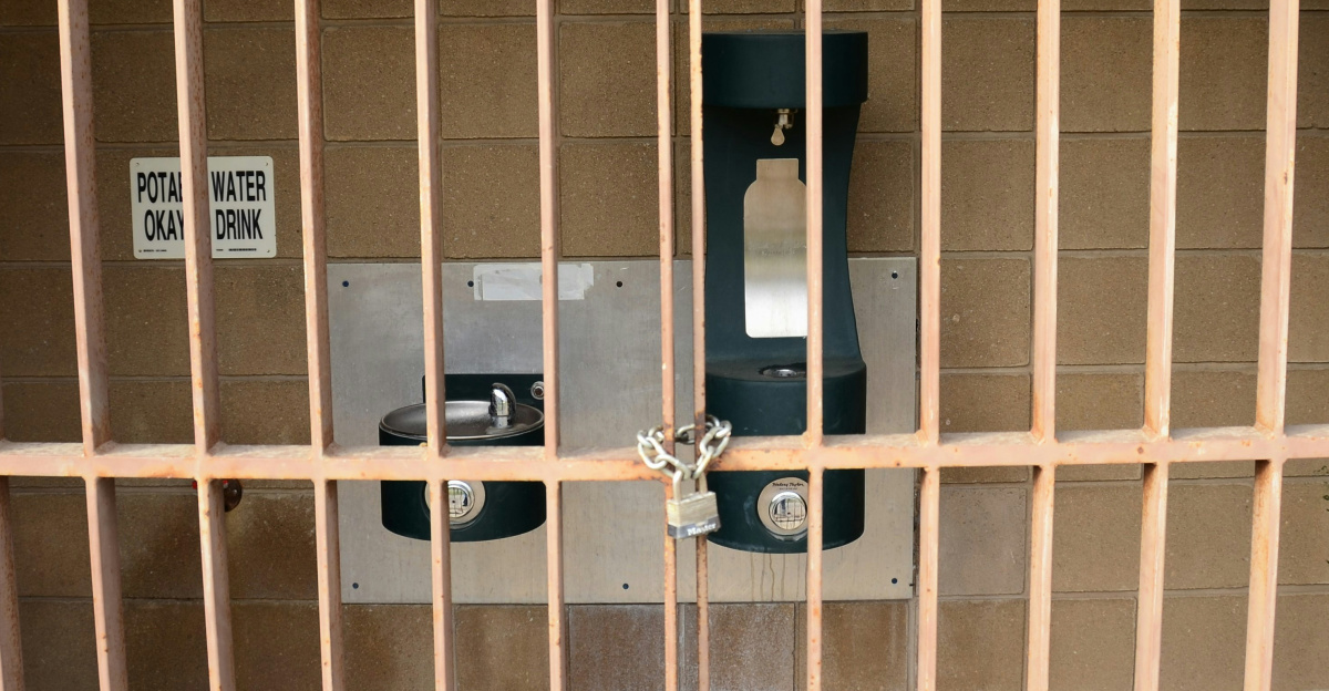 a cell phone in a wooden jail cell