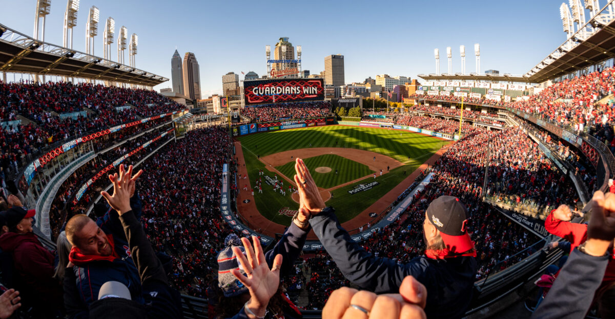 Cleveland Guardians fans celebrate as the Guardians win Game 2 of the American League Wild Card Series at Progressive Field in Cleveland