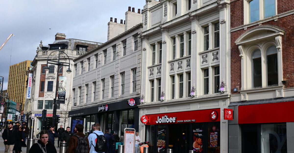 Neighbouring Jolilbee and Wendy s restauraunts on Briggate Leeds