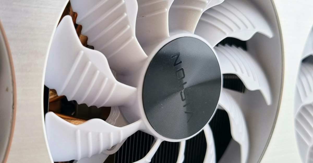 a close up of two fans on a metal surface