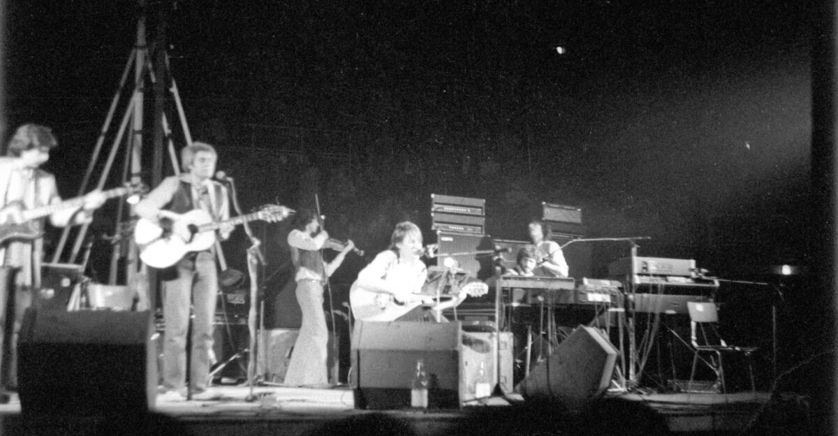 man playing guitar on stage