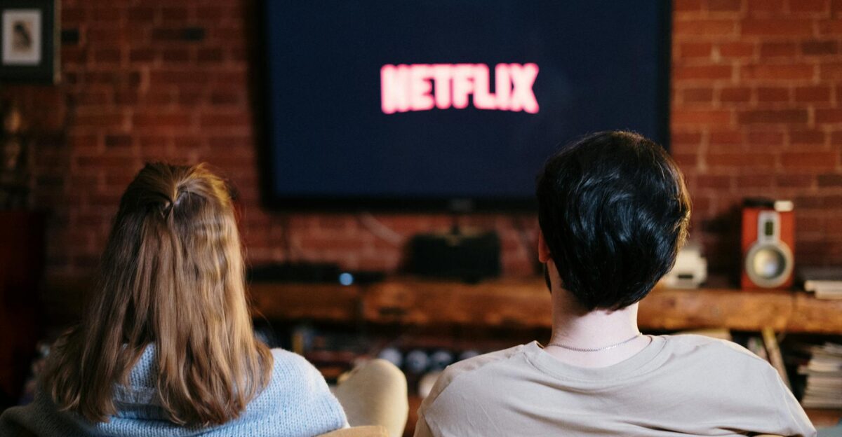 A couple enjoys a relaxed evening watching Netflix in their living room