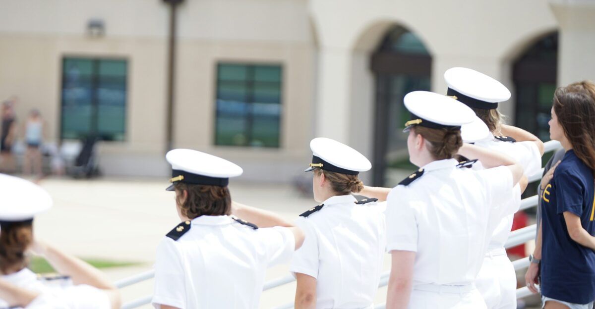 five person wearing white suits