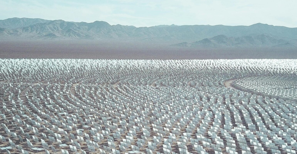 Aerial view of a vast solar farm in a desert setting, capturing renewable energy technology.