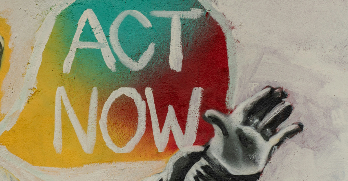 man saying act now painting