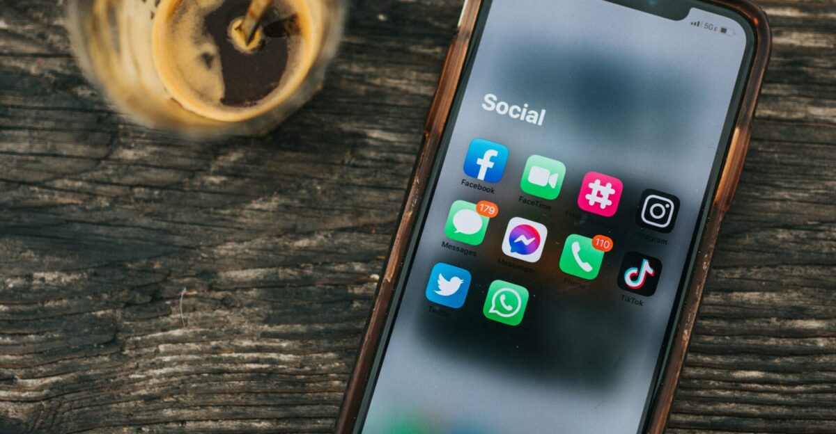 white samsung android smartphone on brown wooden table